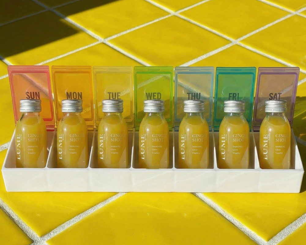 LUME ginger shots arranged in a weekly day-by-day tray — designed for daily consumption, Hong Kong